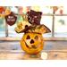 This is a hand carved gourd character for your fall table decorating. I have carved a happy face into the shell and made a autumn hat.